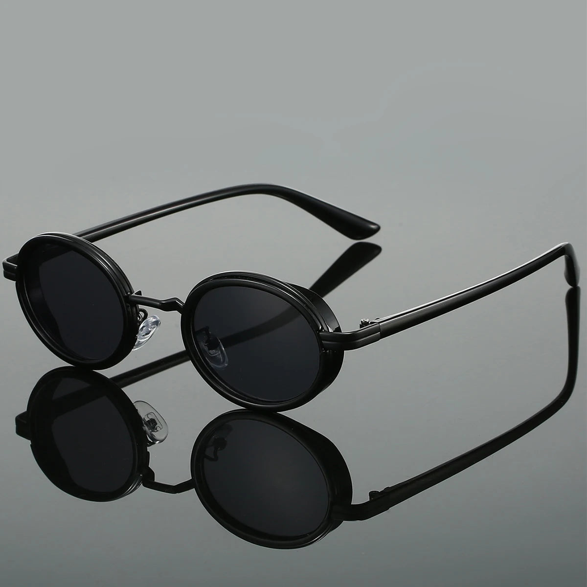 Black steampunk round sunglasses with sleek circular metal frame, deep black lenses, and adjustable nose pads
