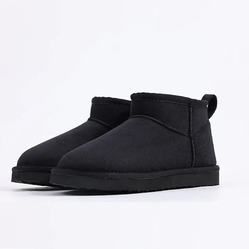 Women's black non-slip ankle boots with cozy cotton lining and grippy winter sole for icy surfaces