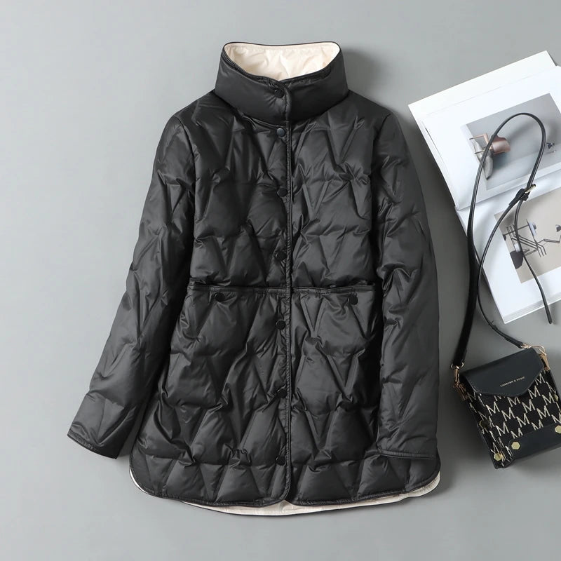 Women's mid-length quilted down jacket in neutral tone with diamond stitching and snap closure