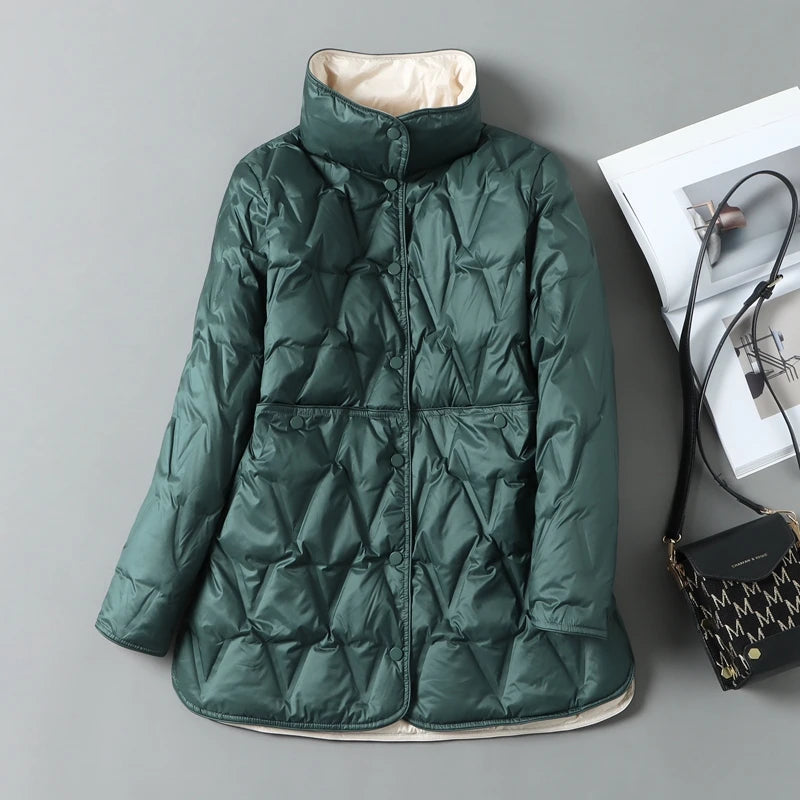 Women's mid-length quilted down jacket with diamond stitching, snap closures, and flattering waist silhouette