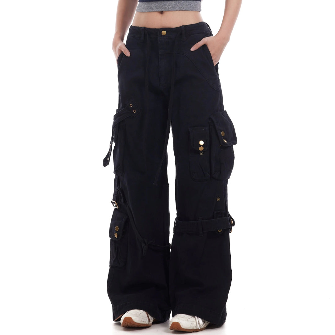 Loose-fit boot-cut cargo pants in neutral tone with adjustable straps and deconstructed detailing