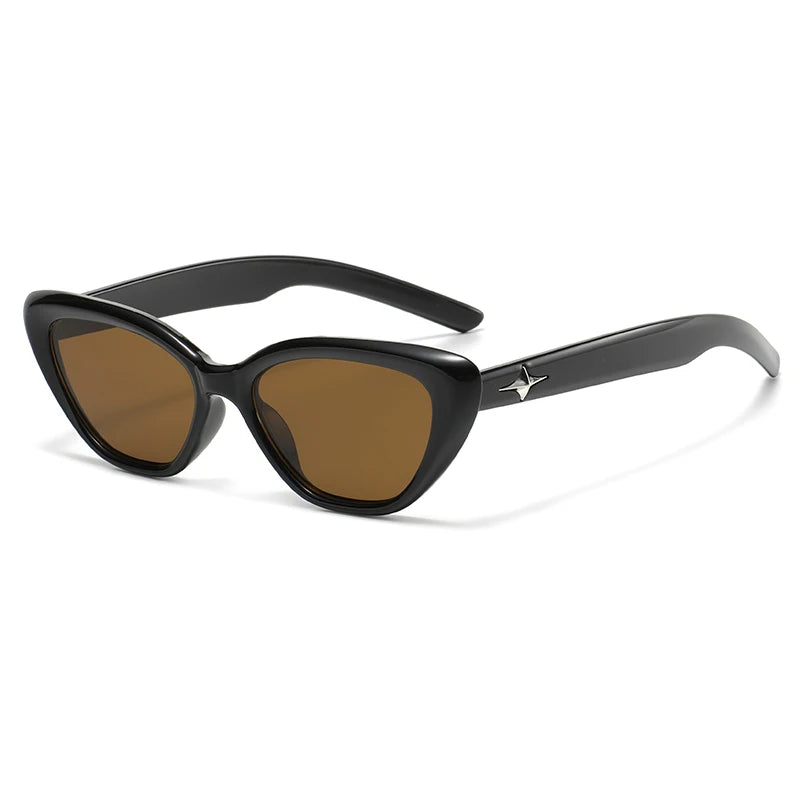 Glossy black cat-eye sunglasses with star-detail temple accents, bold cosmic style