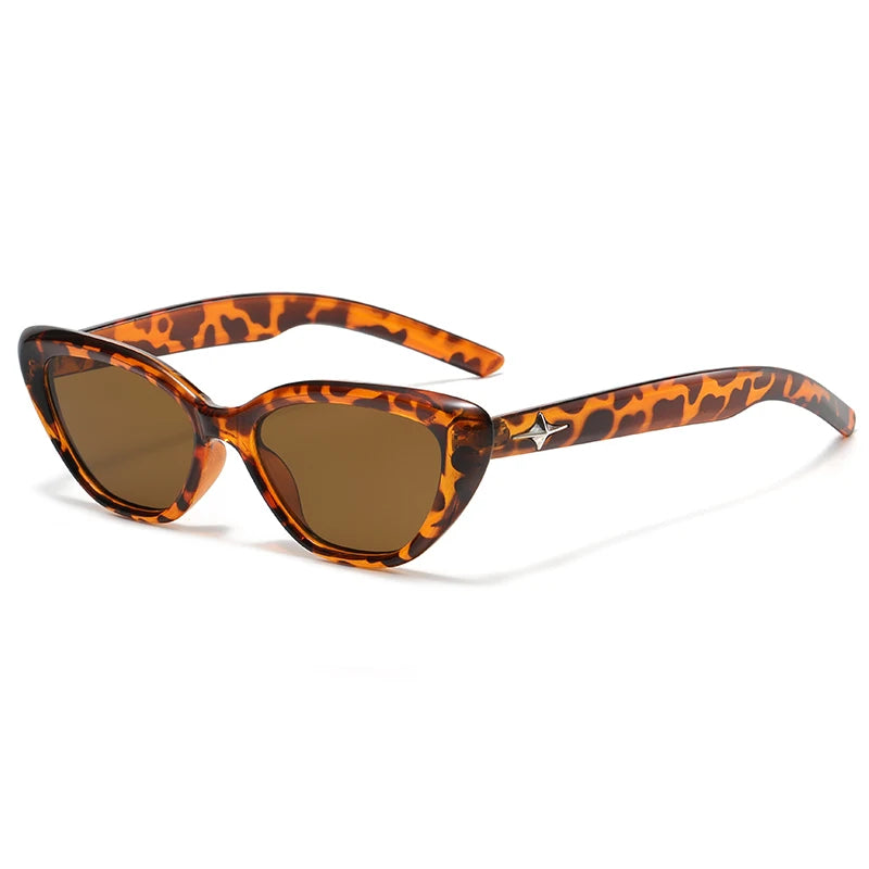 Glossy black cat-eye sunglasses with sleek acetate frame and star-detail temple accents