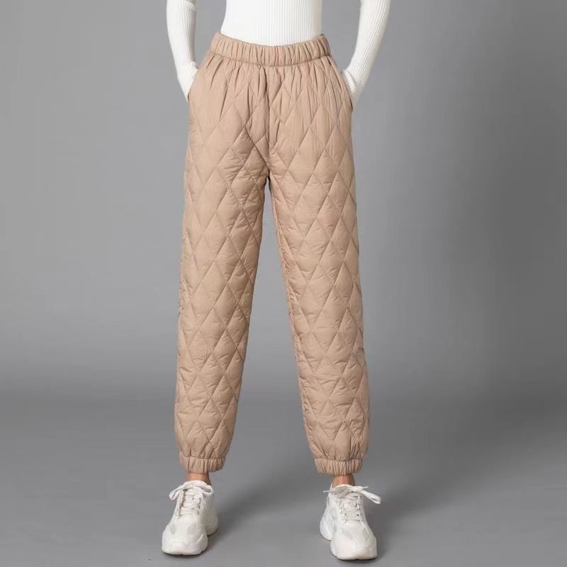 Black diamond-quilted jogger pants with elastic waistband and cuffs, lightweight padded street style fit