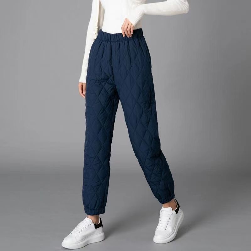 Black diamond-quilted jogger pants with elastic waistband and cuffs, lightweight padded street style fit