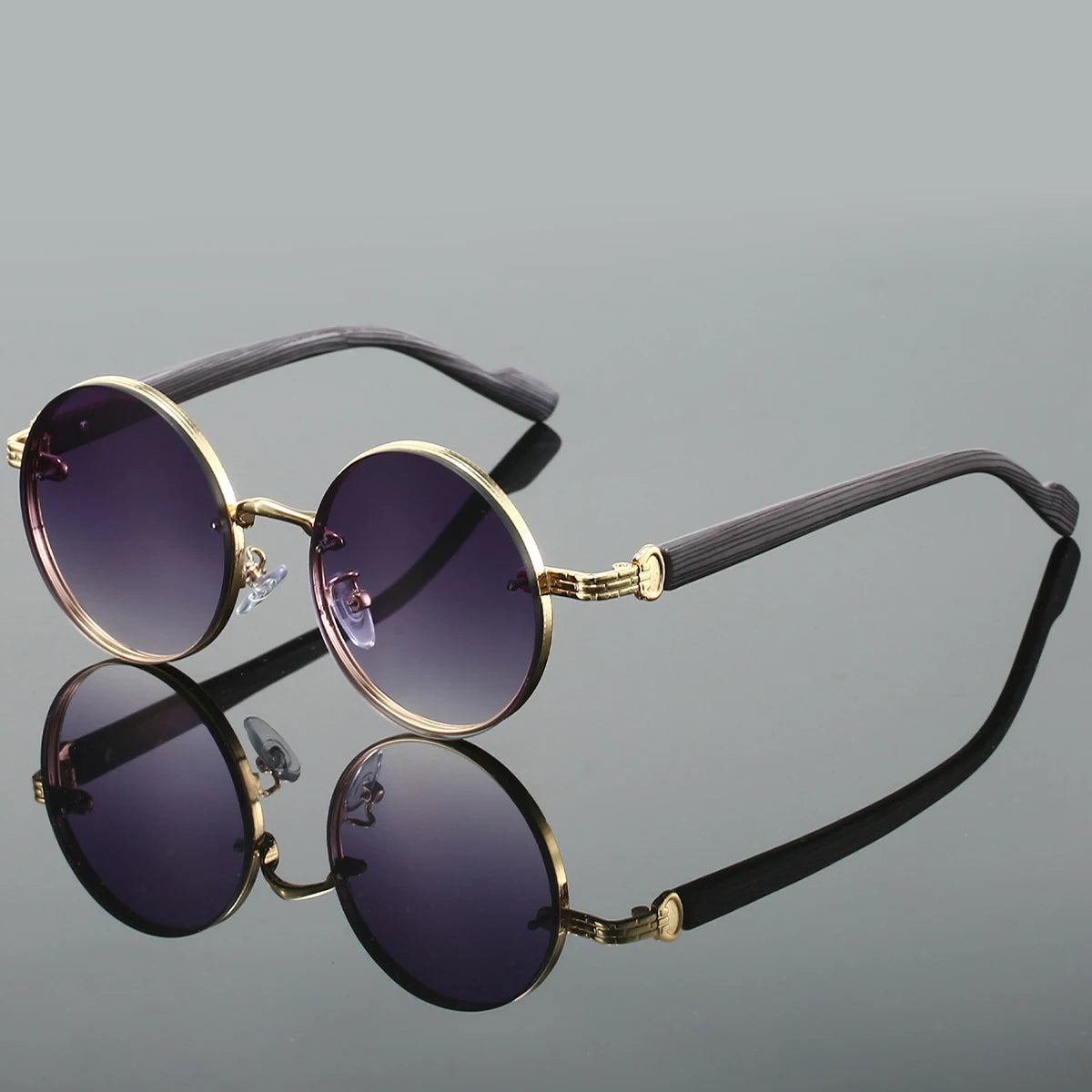 Matte black round sunglasses with textured arms and UV400 dark lenses, retro minimalist style