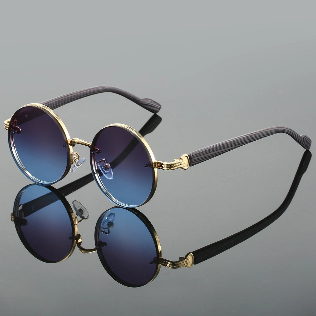 Matte black round sunglasses with textured arms and UV400 dark lenses, minimalist retro style
