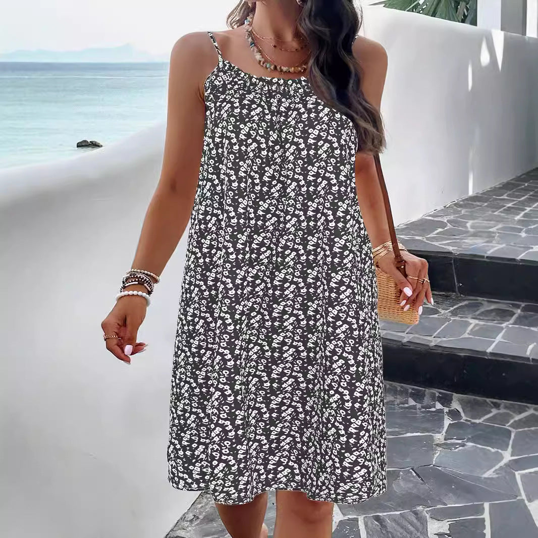 Floral print women's swing dress in cotton blend with adjustable straps and knee-length hemline