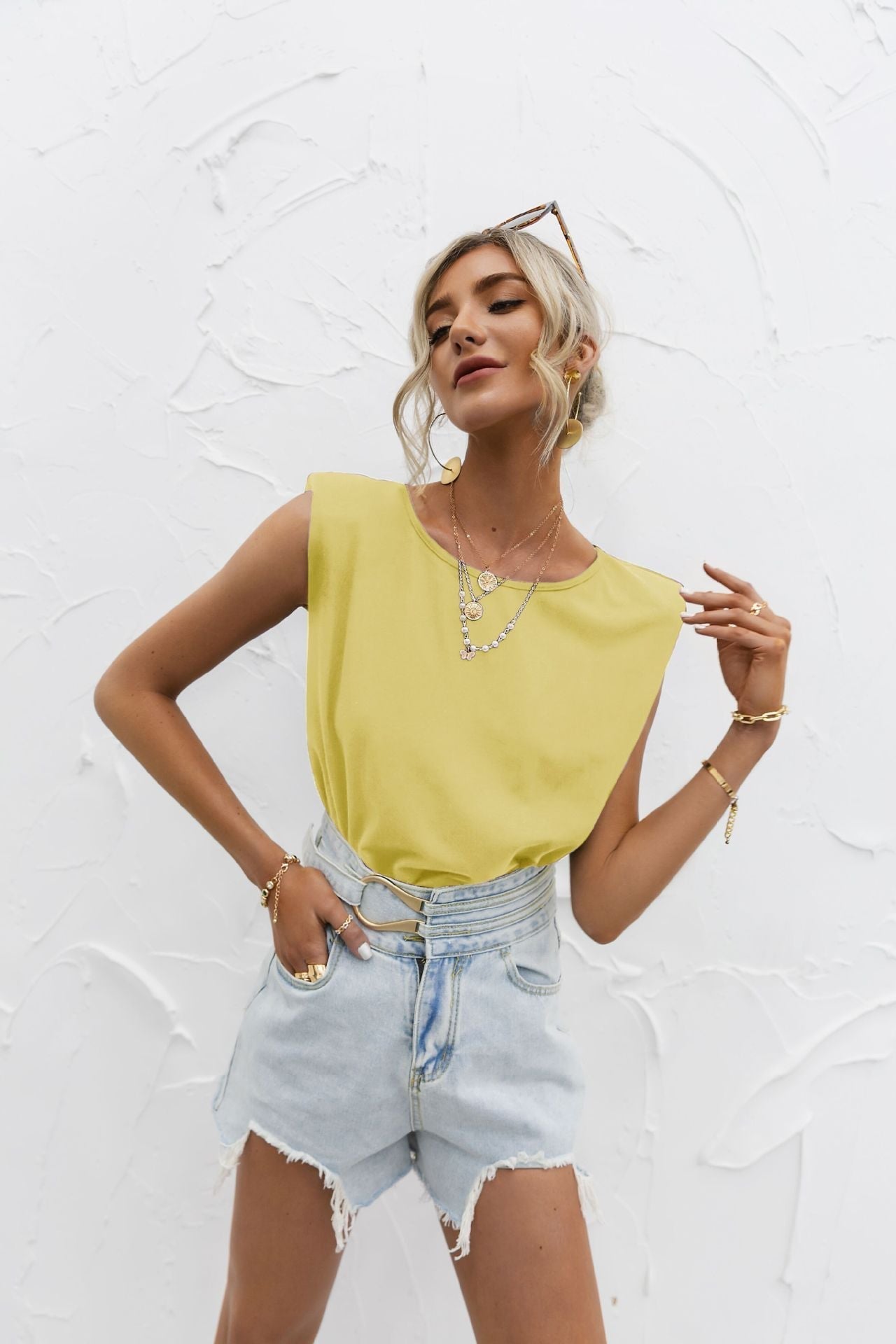 Women's white relaxed-fit short sleeve top with extended shoulders in lightweight cotton blend
