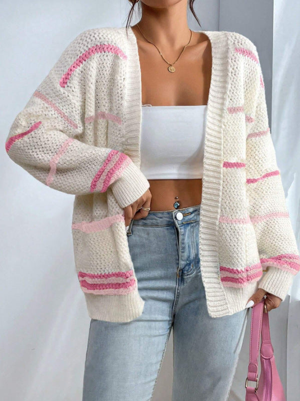 Women's oversized knit cardigan with wide horizontal stripes and soft ribbed edges in Nordic style