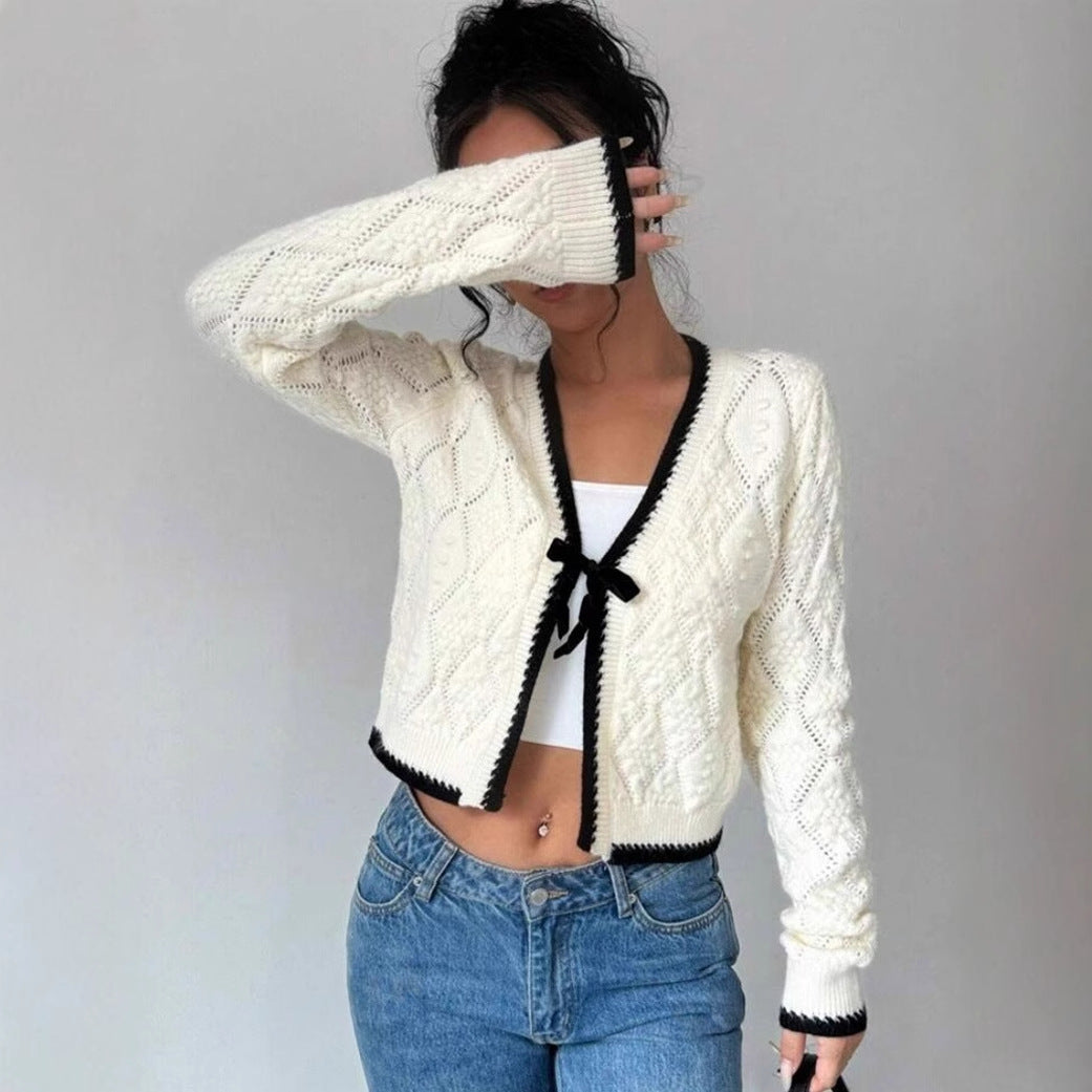 Women's cropped knit cardigan with bow closure and contrast trim, cozy casual layering piece
