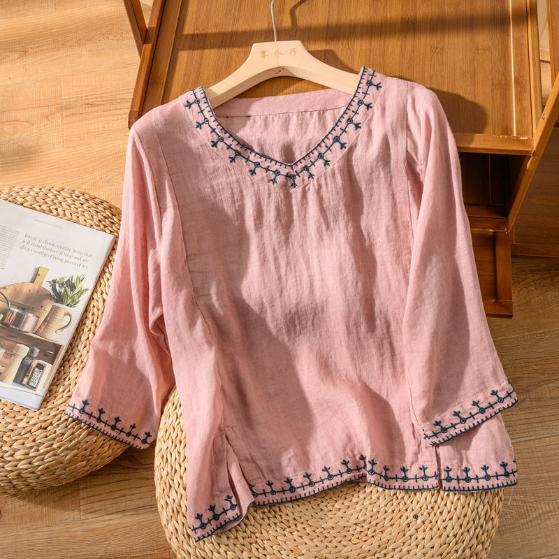 Floral embroidered V-neck blouse with soft flowing silhouette and delicate stitched neckline details
