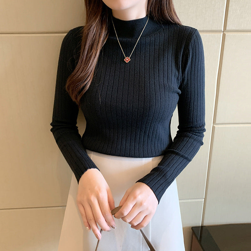 Cream ribbed turtleneck fitted knit top with cozy fold-over collar for fall layering