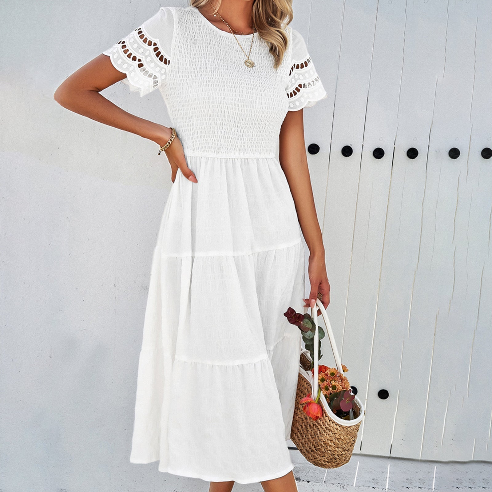 Women's loose fit midi dress with smocked bodice, tiered skirt, and cut-out short sleeves in cotton