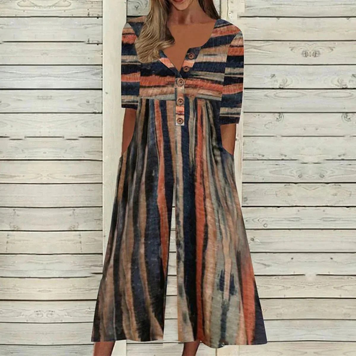 Women's leaf print wide-leg jumpsuit in blue and white, V-neck with button detail, short sleeves