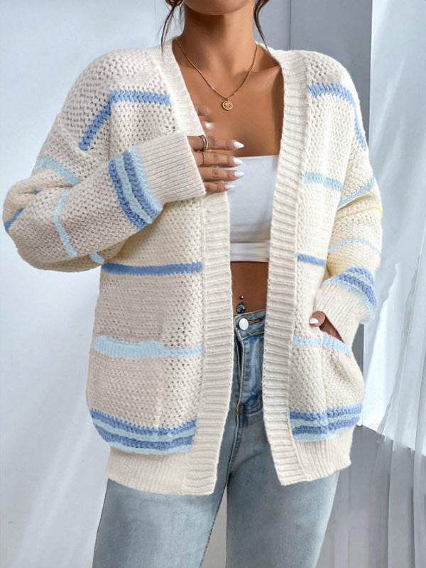 Women's oversized knit cardigan with wide horizontal stripes and soft ribbed edges in Nordic style