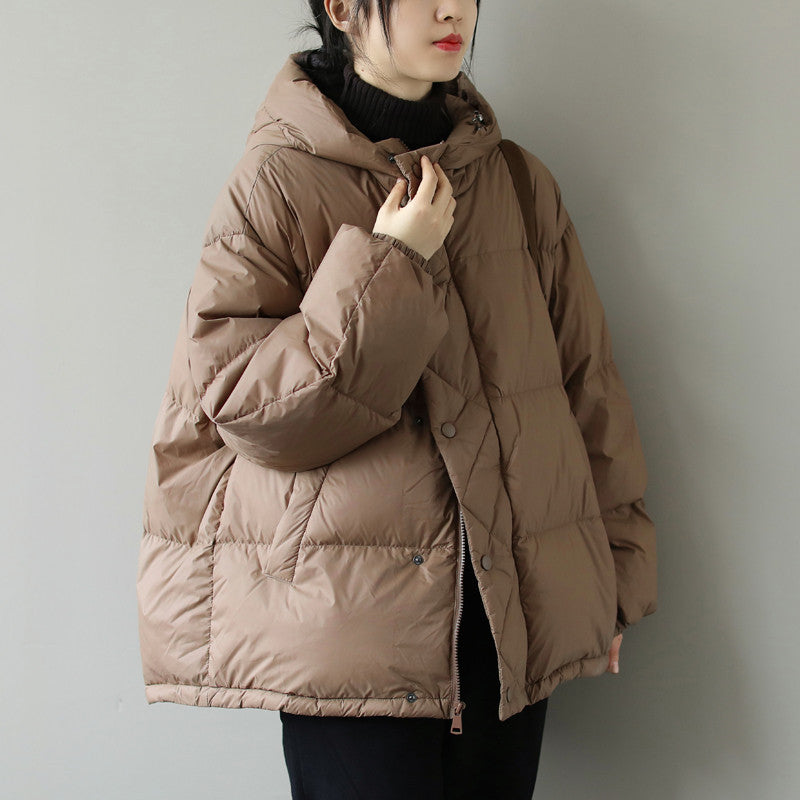 Black quilted hooded puffer jacket with premium insulation, sleek winter outerwear for women