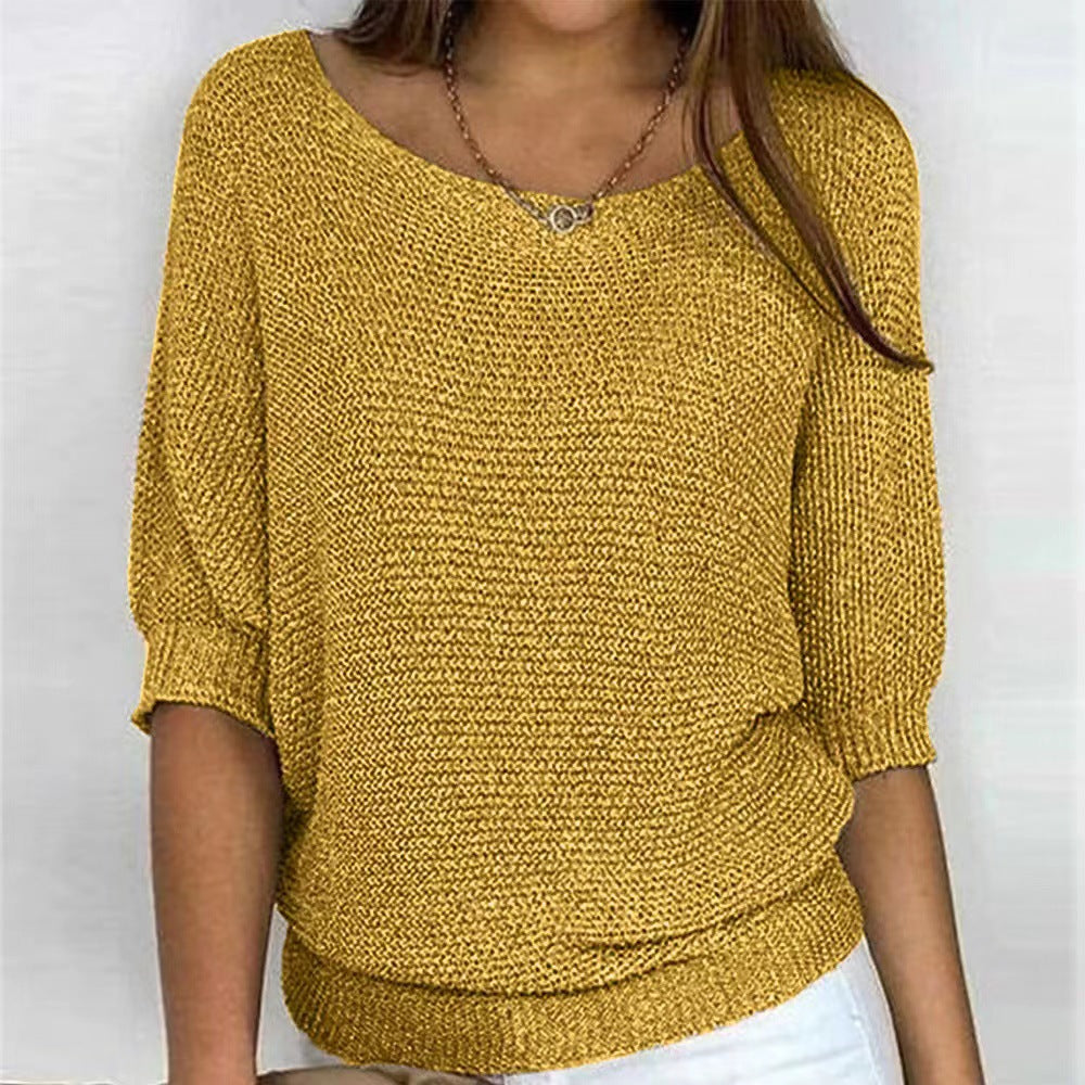 Cozy oversized knit sweater in soft neutral tones with a relaxed silhouette and featherlight texture
