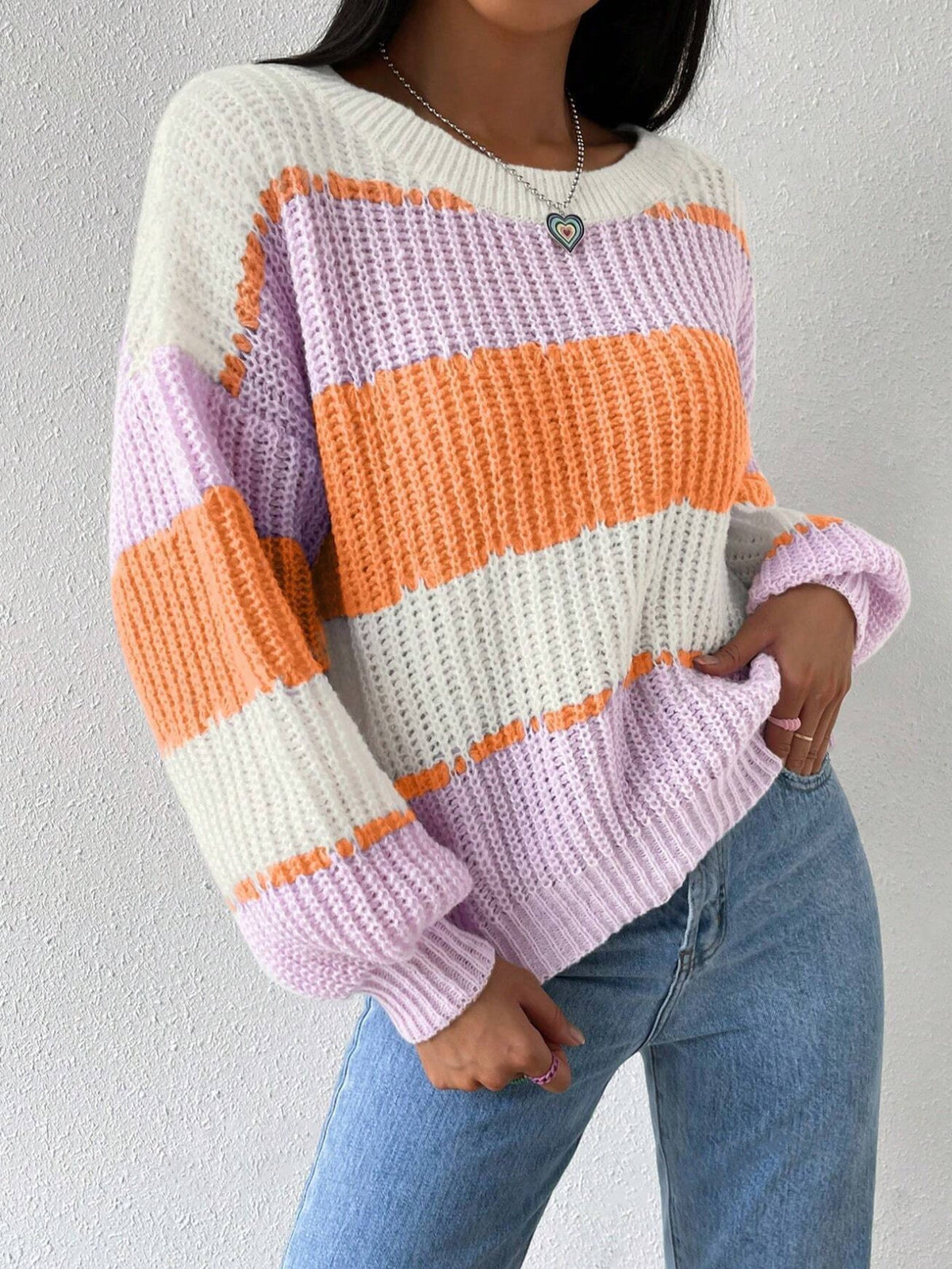 Women's striped knit pullover sweater in cozy soft fabric with classic timeless stripe pattern
