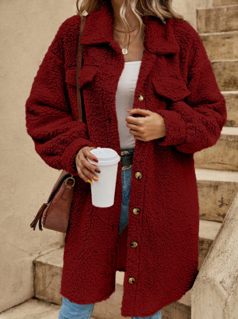 Women's oversized plush fleece long coat in neutral tone, button-down lapel collar, cozy winter style