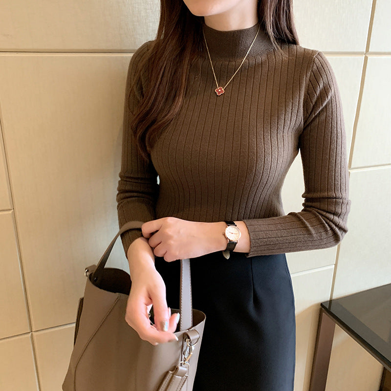 Ivory ribbed turtleneck fitted knit top with cozy fold-over collar for effortless winter style