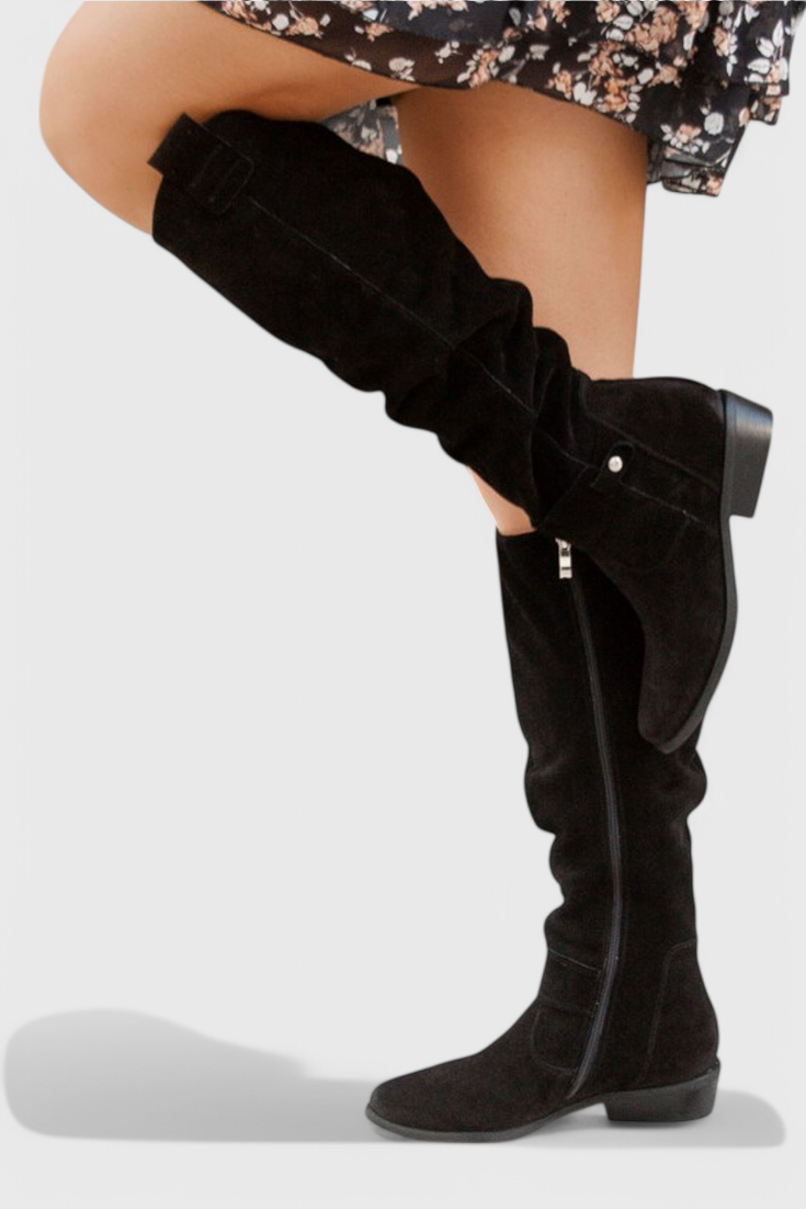 Retro-inspired women's high boots with sleek elongated silhouette and vintage detailing for cold-weather style
