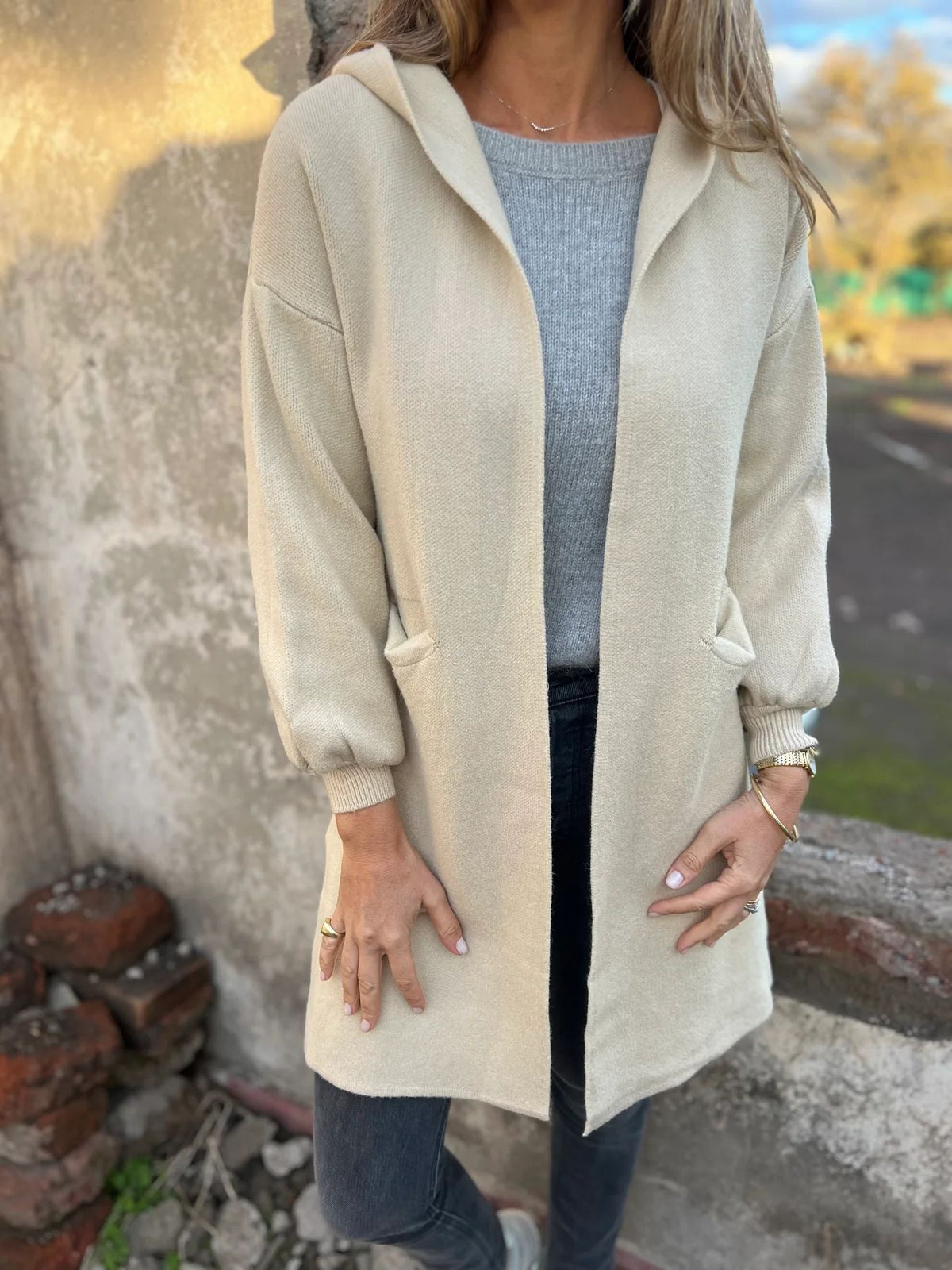 Beige hooded knit cardigan open-front relaxed fit with ribbed cuffs for effortless layering