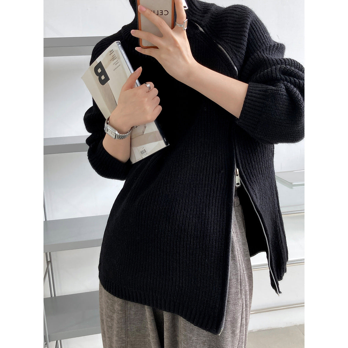 Women's wool blend oversized knit sweater with high collar and distinctive side zipper detail