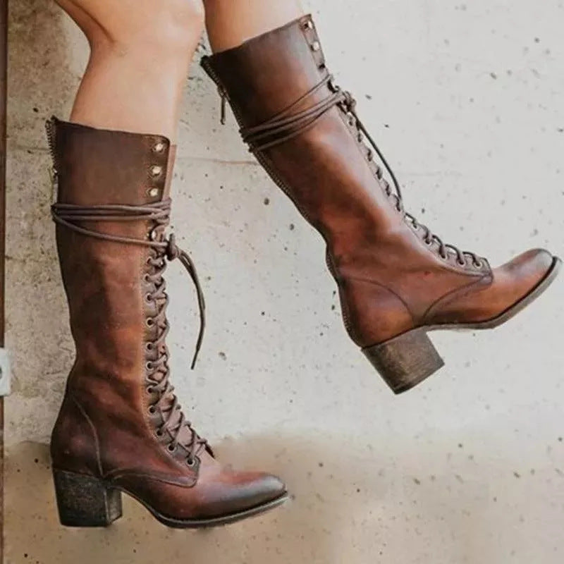 Women's black leather knee-high boots with block heel and lace-up front closure