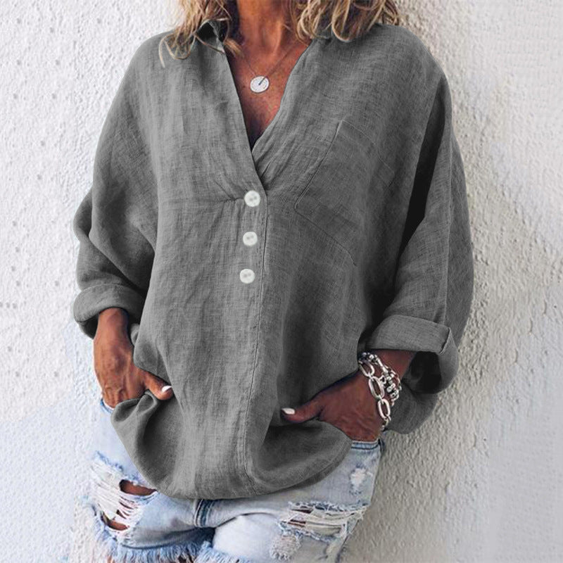 Women's cream linen oversized V-neck top with long sleeves, button placket, and chest pocket