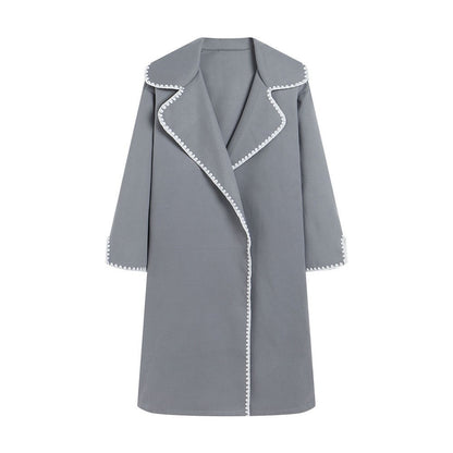Women's oversized wool windbreaker jacket with lapel collar and delicate shell embroidery detail