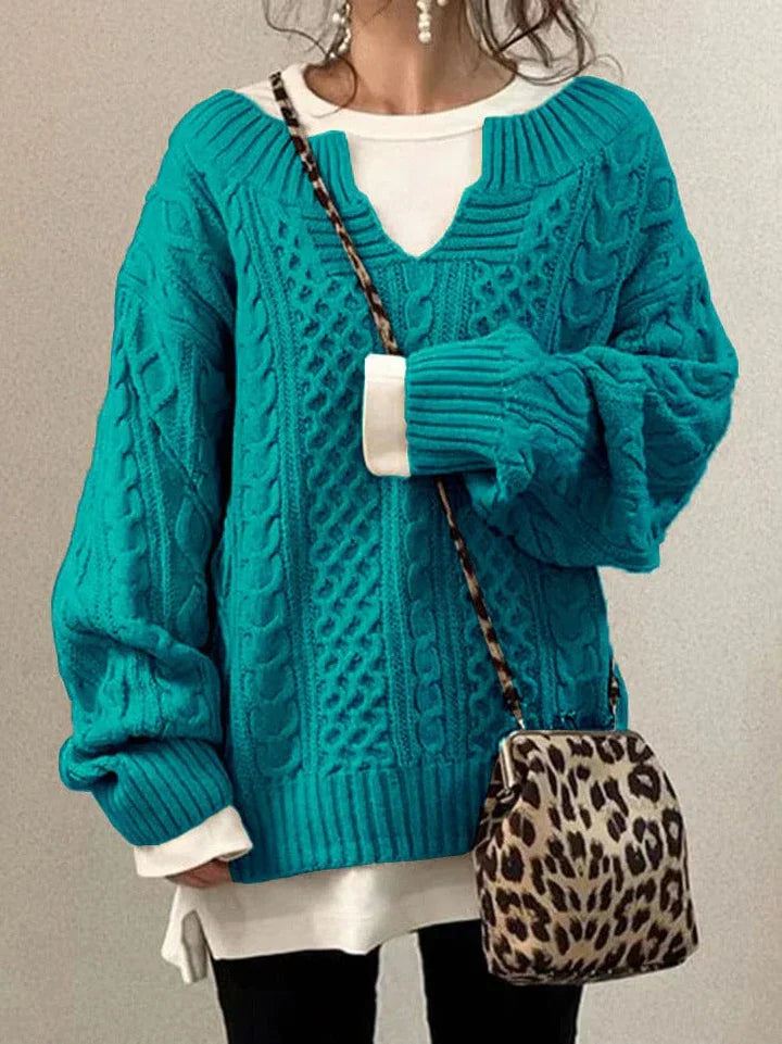 Elegant wool knit sweater in neutral tone, classic relaxed fit with refined texture for polished everyday style