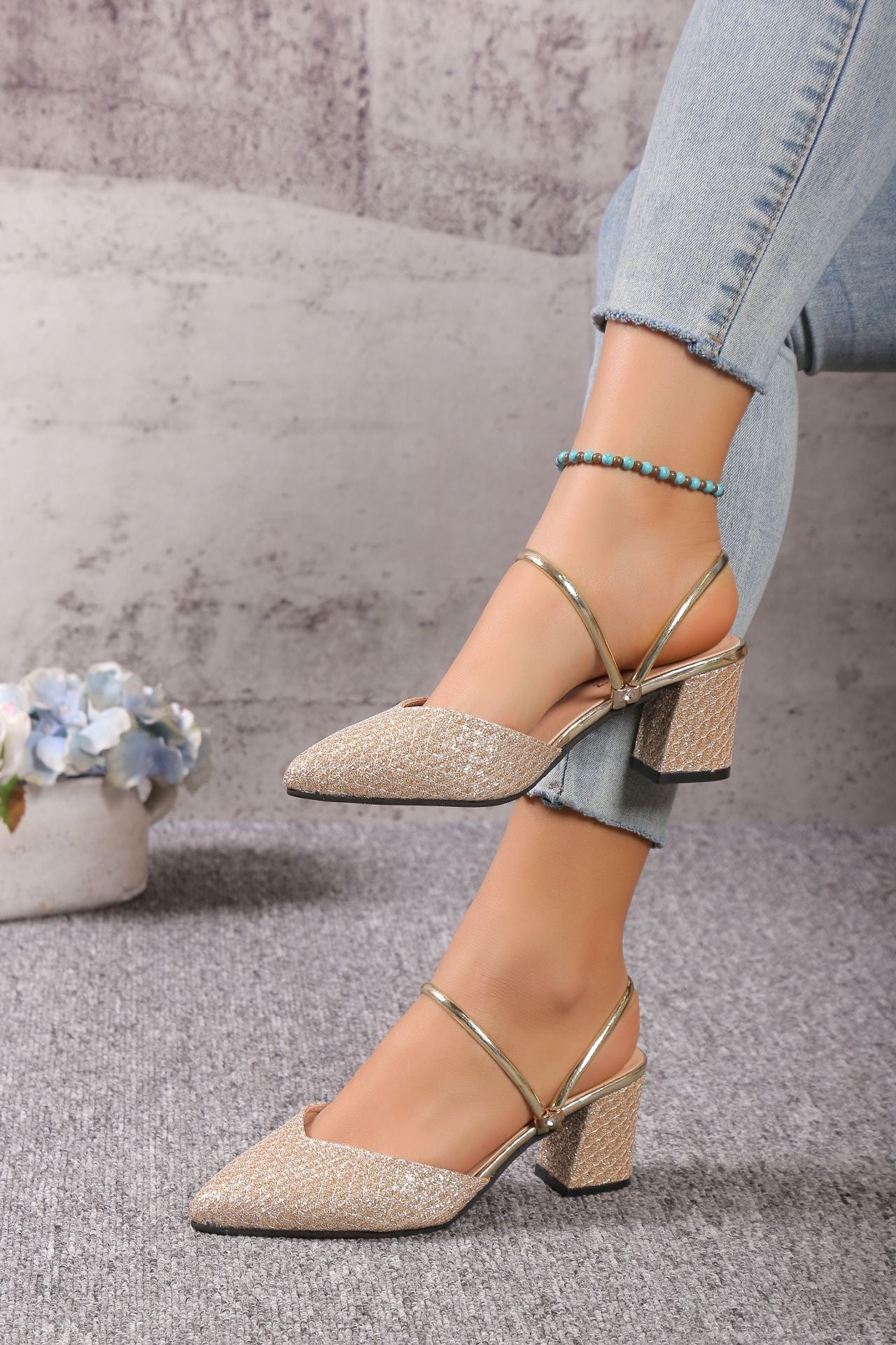 Beige block heel mules with pointed toe, delicate strap, and slip-on PU leather upper