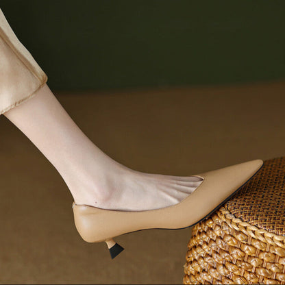 Nude pointed toe kitten heel pumps with sleek slip-on silhouette and flared low heel