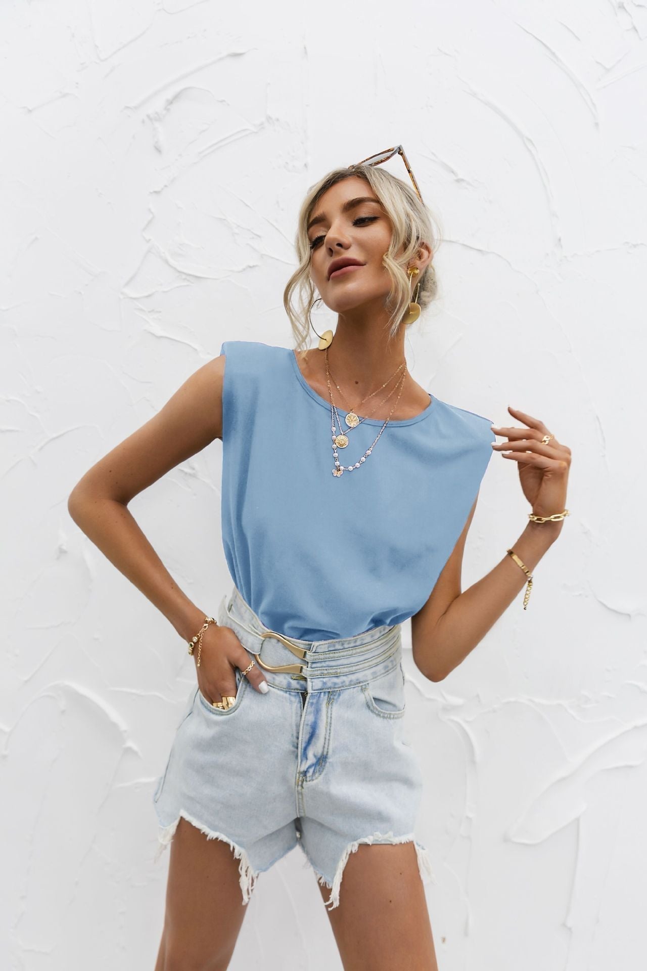 White relaxed-fit short sleeve top with extended shoulders in lightweight cotton blend