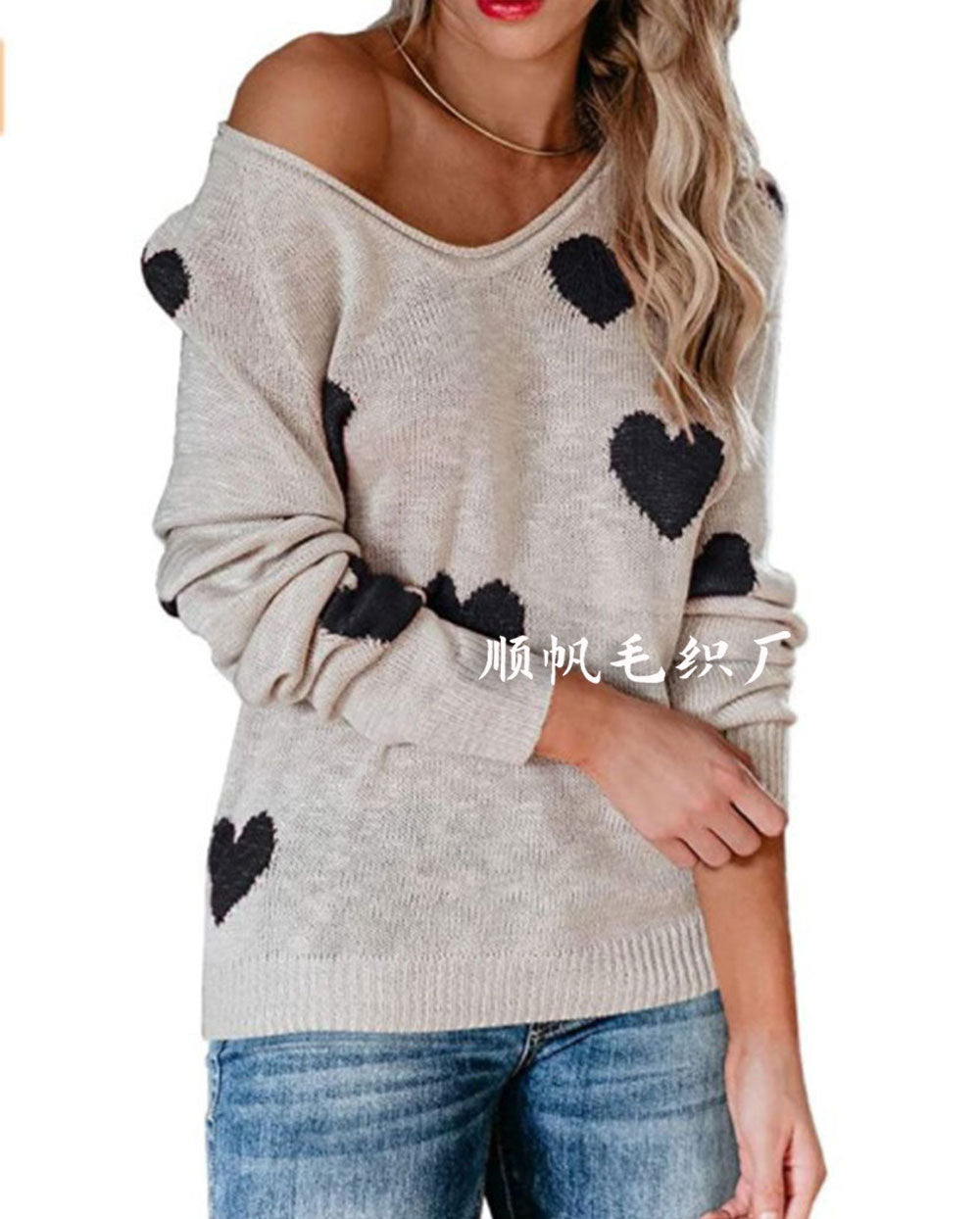 Cream relaxed-fit unisex knit sweater with allover heart pattern, cozy soft texture