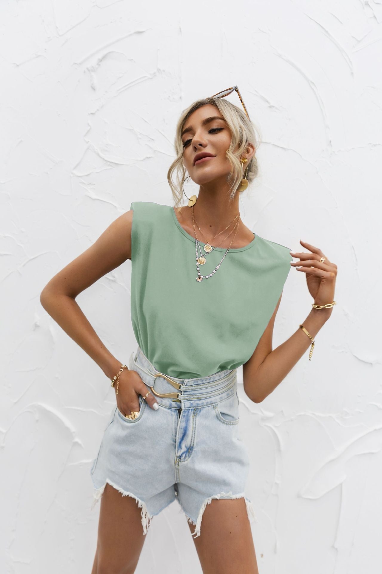 White relaxed-fit short sleeve top with extended shoulders in lightweight cotton blend