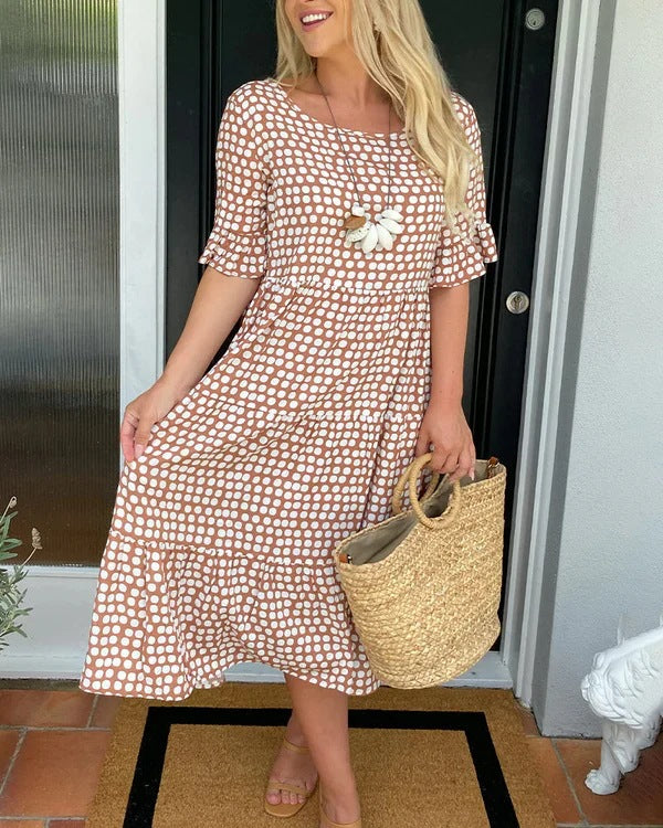 Black white dotted relaxed midi dress with softly tiered silhouette and breathable fabric
