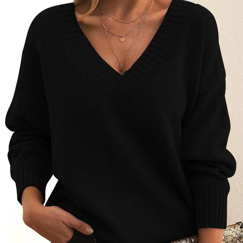 Women's cream relaxed-fit V-neck knit sweater with ribbed cuffs, cozy soft fabric