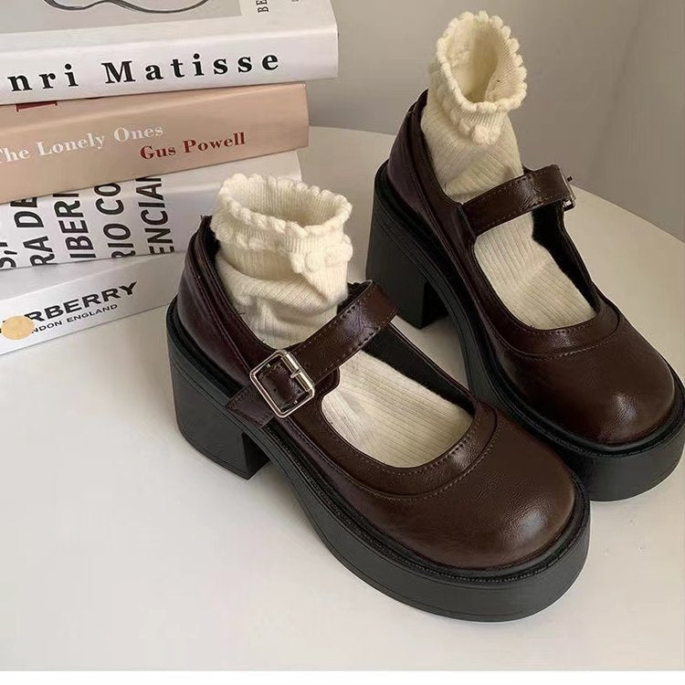 Women's black glossy platform Mary Jane shoes with chunky block heel and rounded toe retro style