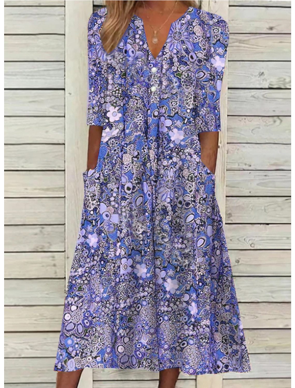 Floral elegant summer dress with flowy silhouette and flattering tummy-cover drape for women