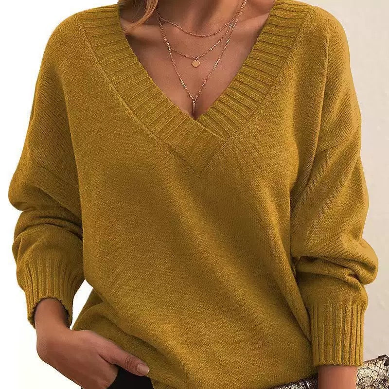 Women's cream relaxed-fit V-neck knit sweater with ribbed cuffs, cozy soft fabric