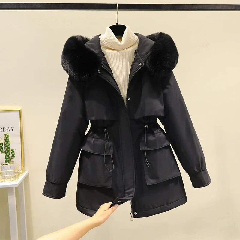 Women's tailored fit parka jacket with faux fur hood, quilted lining, zip front winter coat