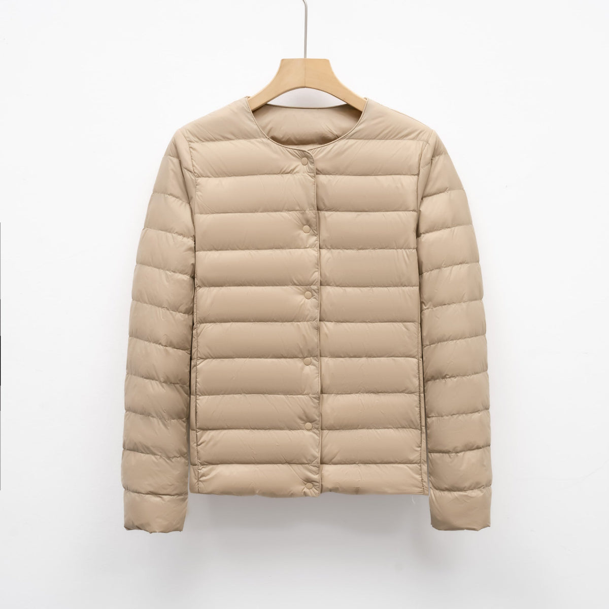 Women's slim fit lightweight quilted down jacket hip length with snap front closure