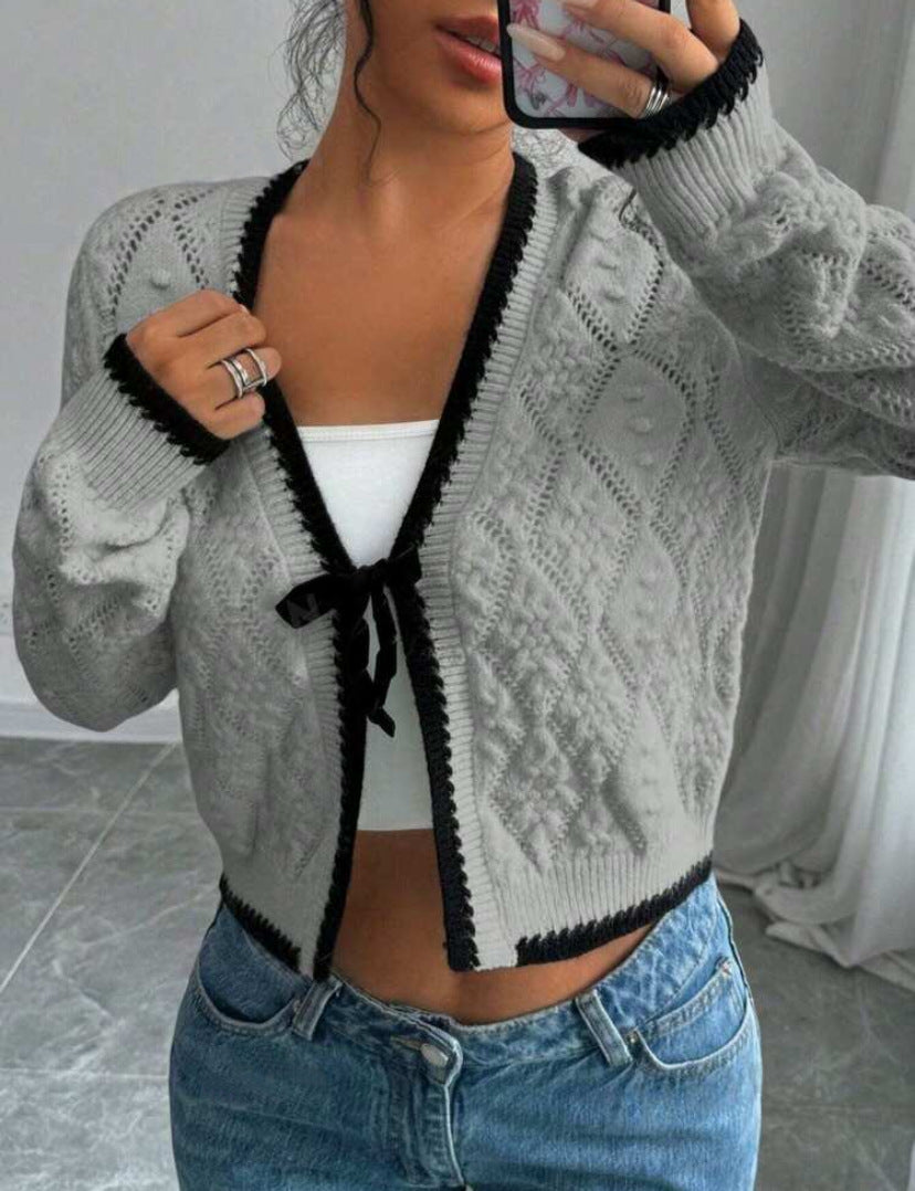 Women's cropped knit cardigan with bow closure and contrast trim, cozy casual layering style