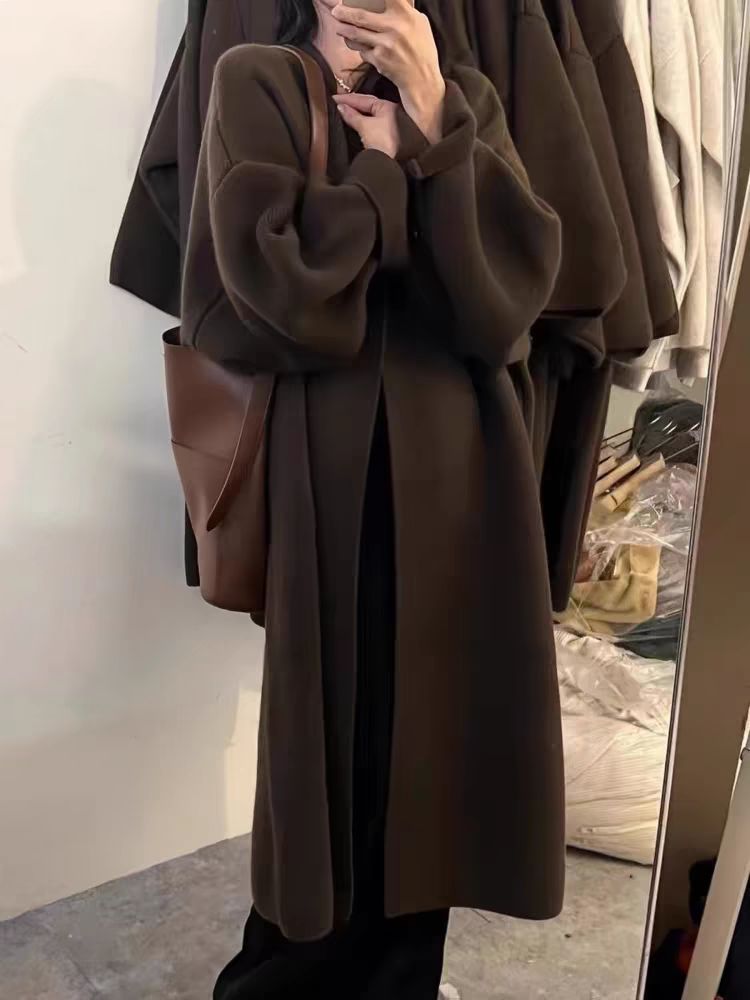 Women's oversized wool knit cardigan coat with draped open front in full-length luxe silhouette