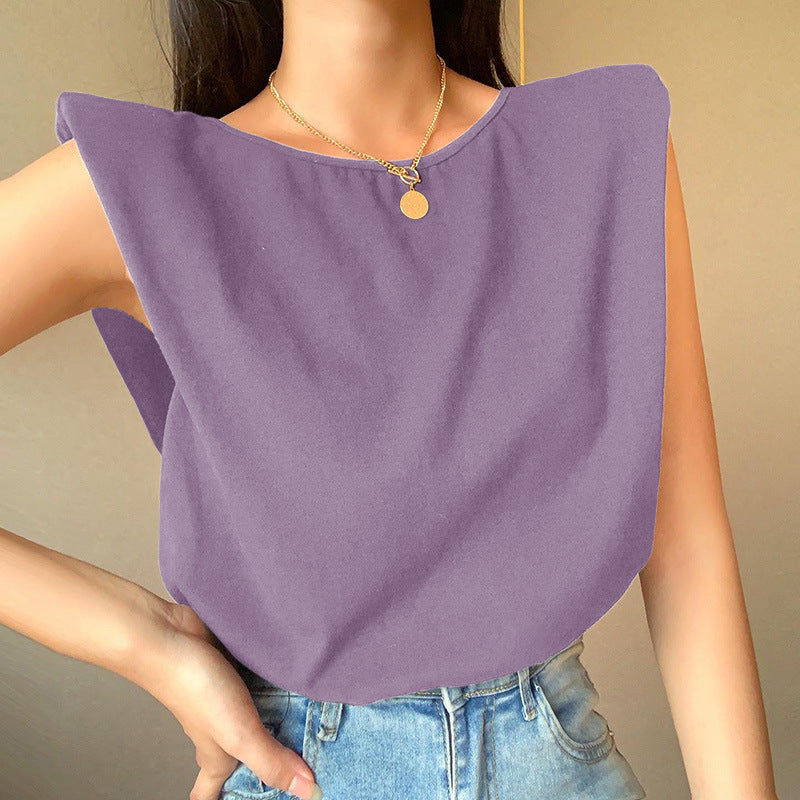 White relaxed-fit short sleeve top with extended shoulders, lightweight cotton blend casual style