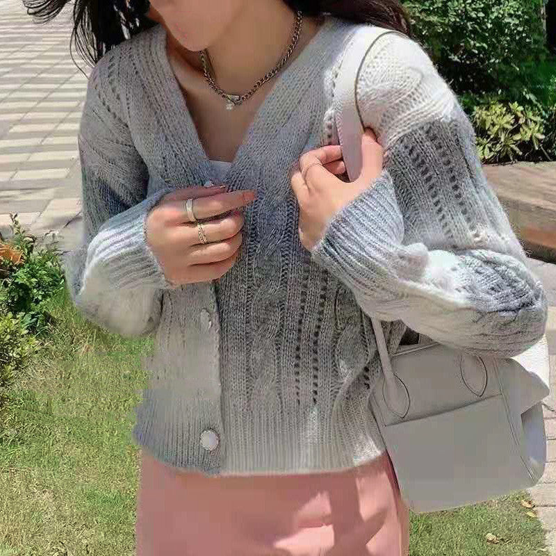 Women's cream cable knit cardigan relaxed fit with button front closure and textured knit pattern