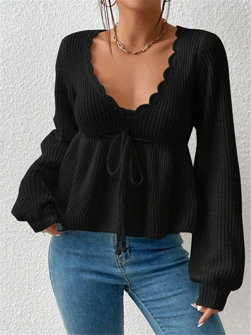 Women's ribbed knit pullover sweater, relaxed fit with drawstring waist and ruffled hem detail