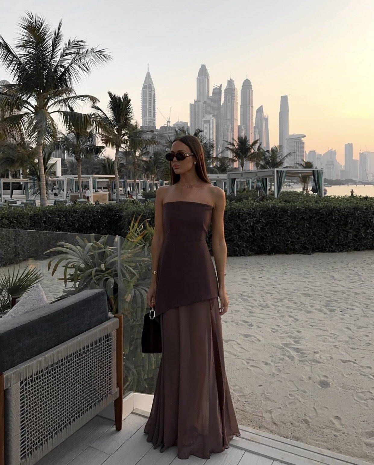 Women's strapless asymmetric maxi dress with patchwork mesh detail, elegant wedding guest style